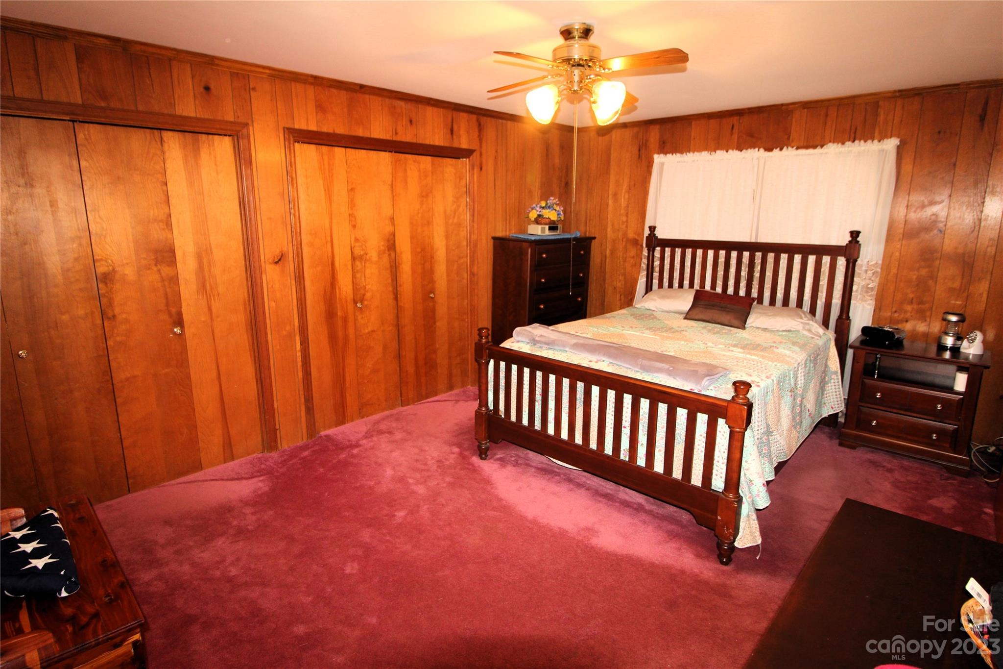 854 Wilmoth Road Clover, SC 29710 - Photo 12 of 33 a bedroom with a bed and a chandelier