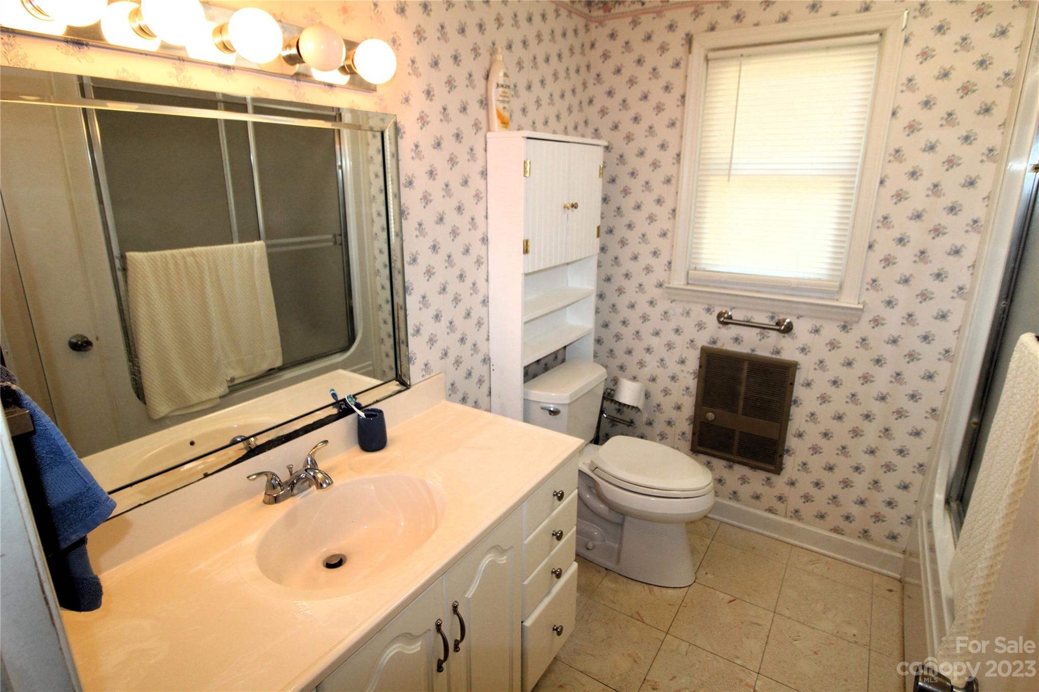 854 Wilmoth Road Clover, SC 29710 - Photo 14 of 33 a bathroom with a sink toilet and shower
