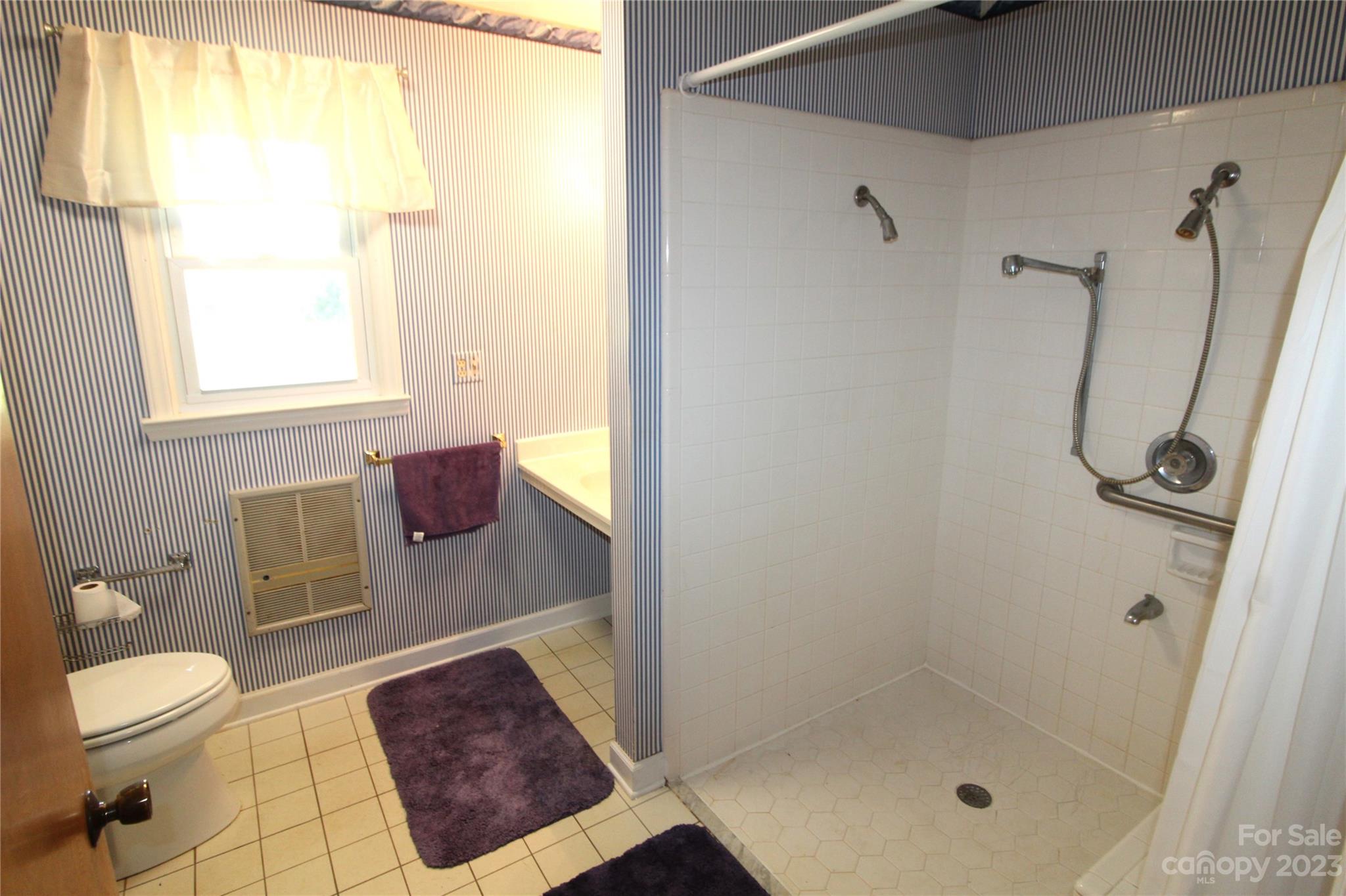 854 Wilmoth Road Clover, SC 29710 - Photo 18 of 33 a bathroom with a shower a toilet and a sink