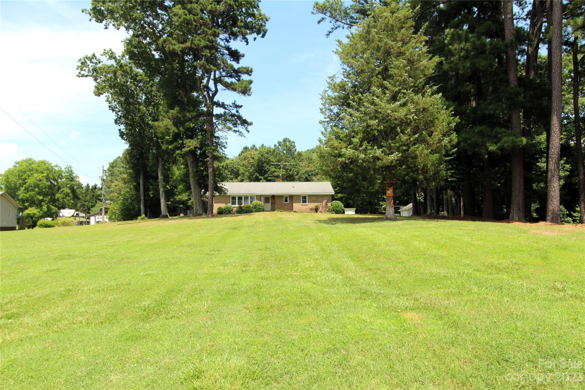 854 Wilmoth Road Clover, SC 29710 - Photo 2 of 33 a view of a house with swimming pool