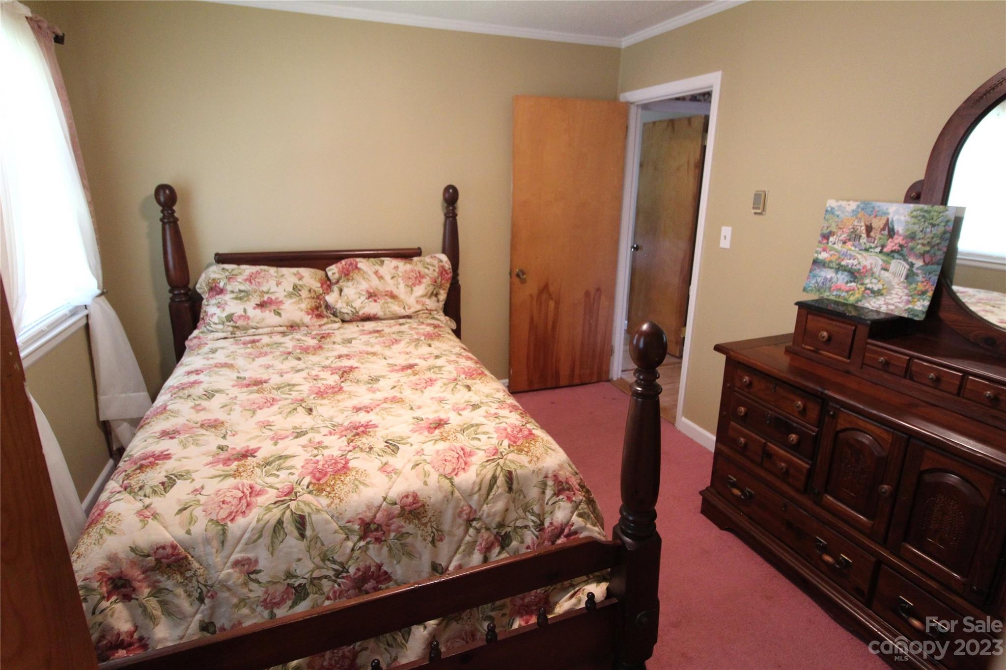 854 Wilmoth Road Clover, SC 29710 - Photo 21 of 33 a bed sitting in a bedroom next to a window