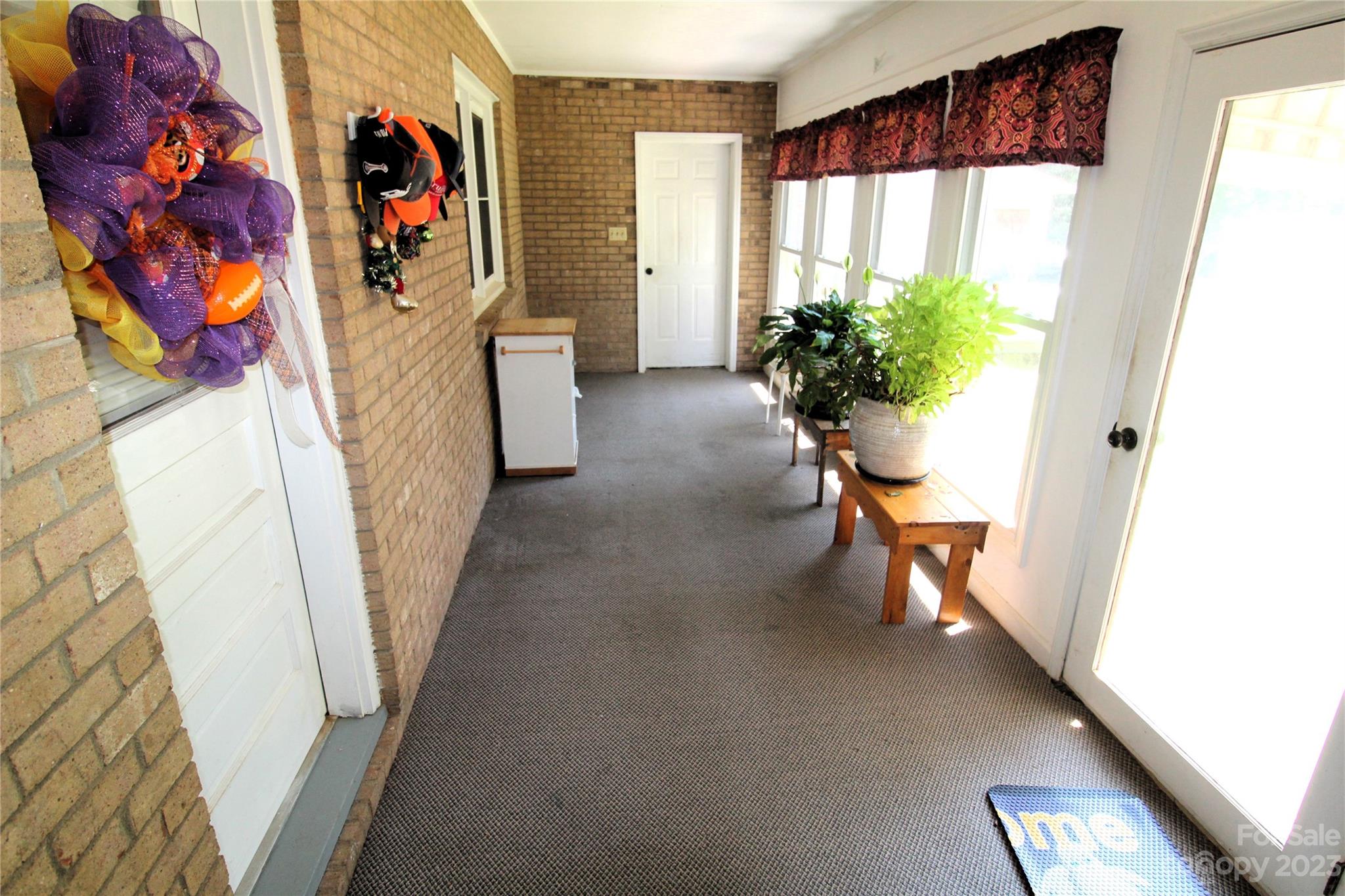 854 Wilmoth Road Clover, SC 29710 - Photo 25 of 33 a view of a hallway with furniture and a potted plant