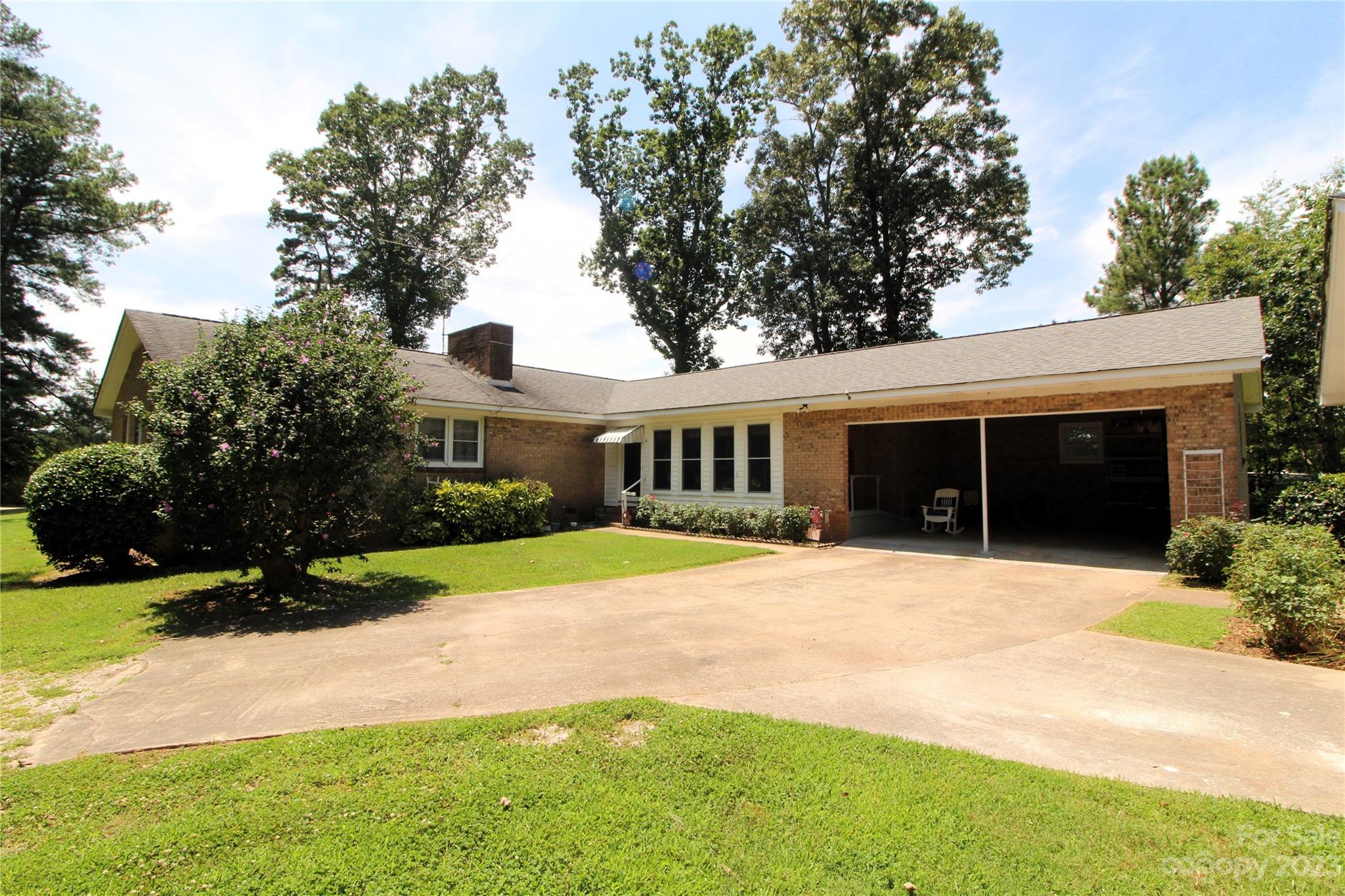 854 Wilmoth Road Clover, SC 29710 - Photo 27 of 33 a front view of a house with a yard and garage