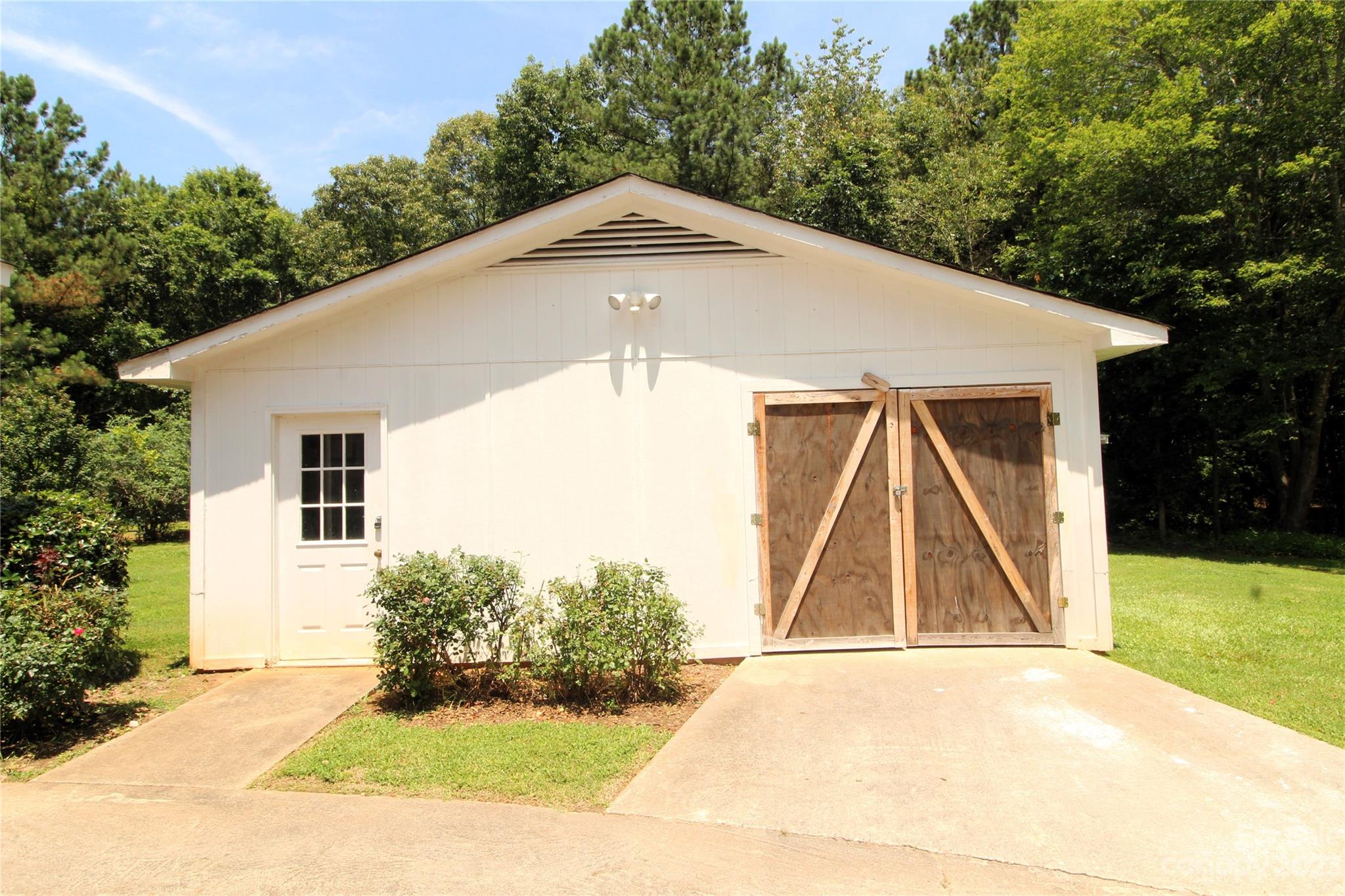 854 Wilmoth Road Clover, SC 29710 - Photo 30 of 33 a front view of a house with a yard and trees