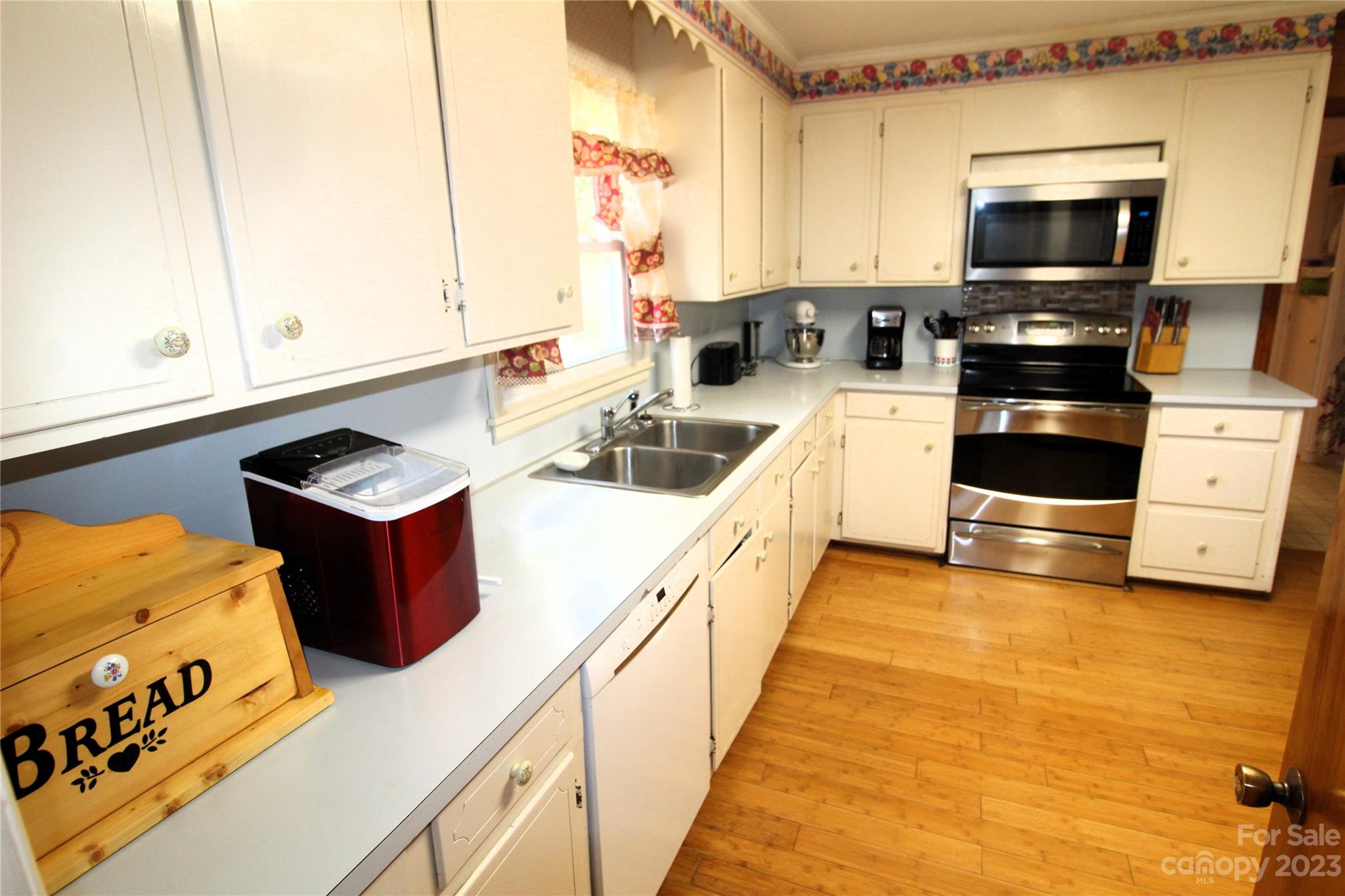 854 Wilmoth Road Clover, SC 29710 - Photo 9 of 33 a kitchen with stainless steel appliances a stove a sink and a microwave