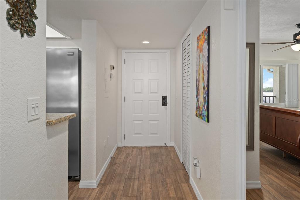 8211 Brent Street, Unit 847 Port Richey, FL 34668 - Photo 3 of 29 a view of a hallway with wooden floor