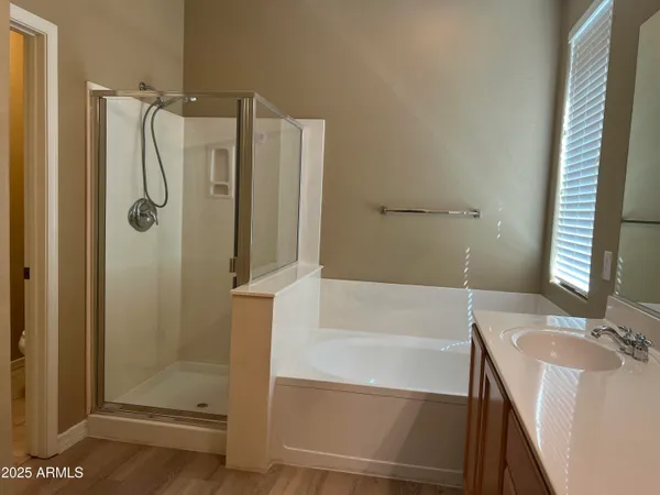 a bathroom with a tub and shower