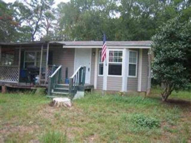222 Churchwell Road Cochran, GA 31014 - Photo 1 of 1 a front view of house with yard