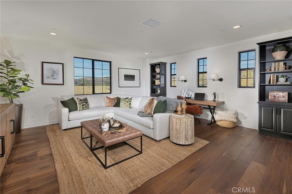 2975 Place De Mouton Bonsall, CA 92084 - Photo 5 of 13 a living room with furniture and wooden floor
