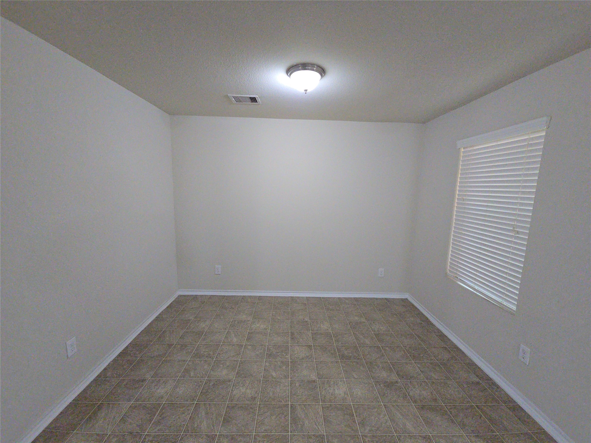810 Lightningbug Lane Conroe, TX 77301 - Photo 18 of 27 a view of an empty room with a window