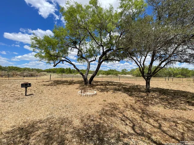 a view of yard with outdoor seating