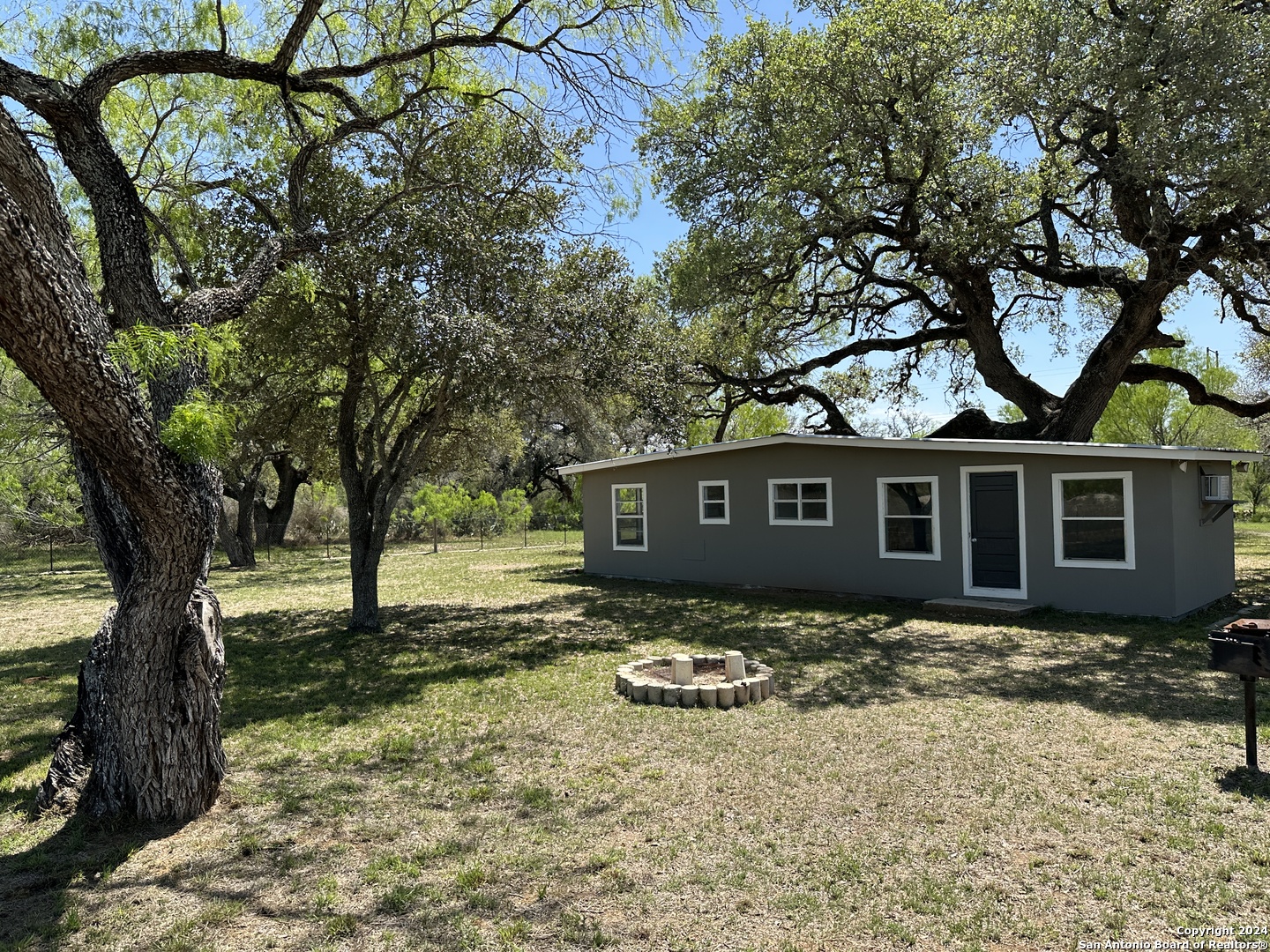 5515 Farm To Market 462 Devine, TX 78016 - Photo 4 of 27 a front view of a house with yard