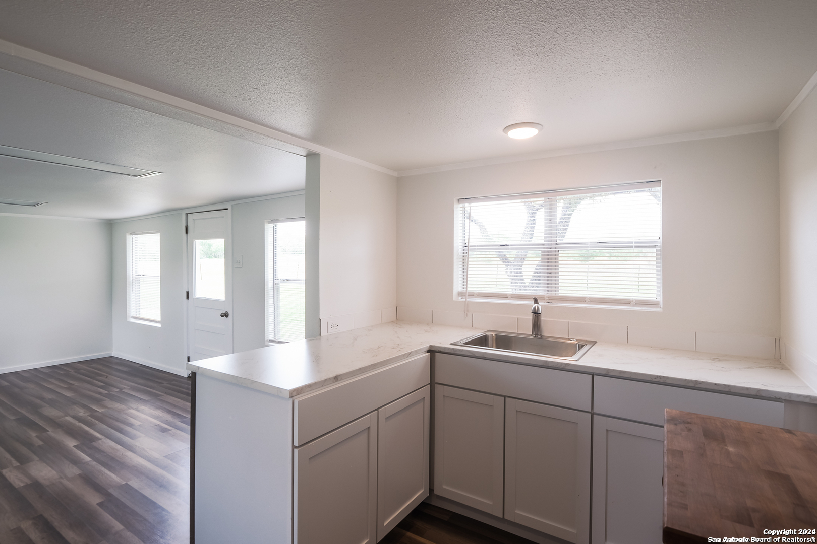 5515 Farm To Market 462 Devine, TX 78016 - Photo 7 of 27 a kitchen with sink and window