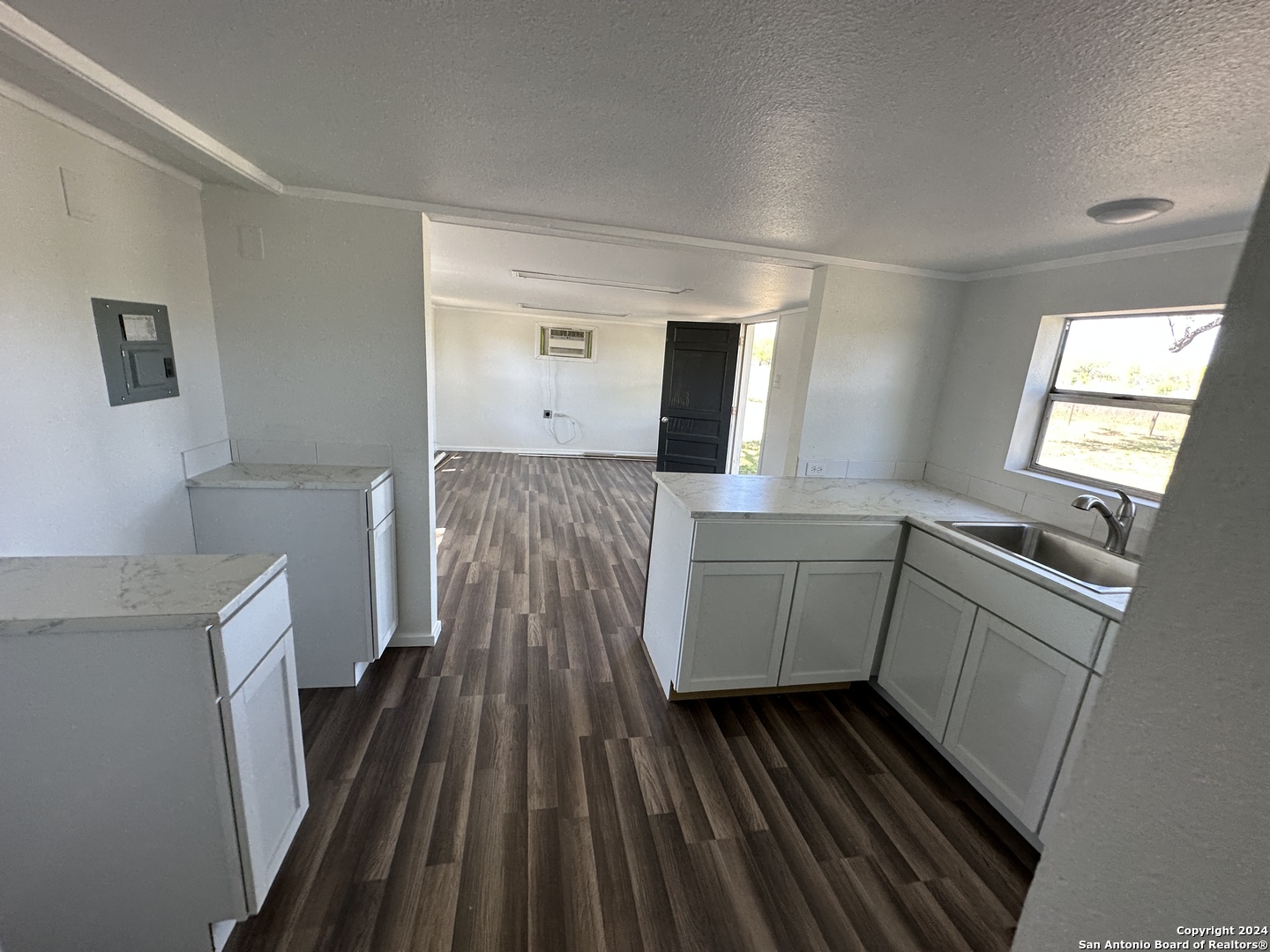 5515 Farm To Market 462 Devine, TX 78016 - Photo 8 of 27 a kitchen with sink and cabinets