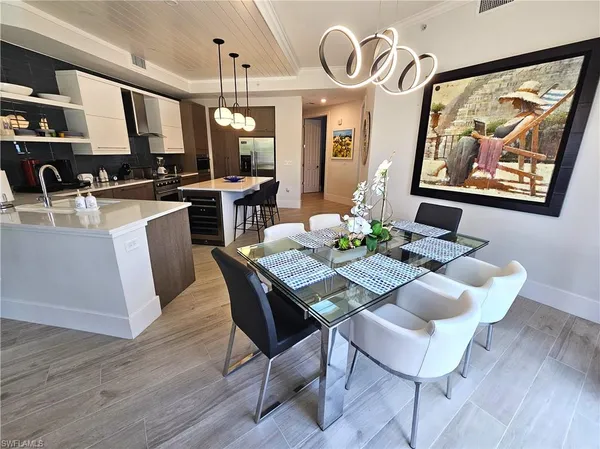 a view of a dining area with furniture and wooden floor