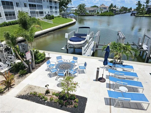 a view of a lake with couches and city view