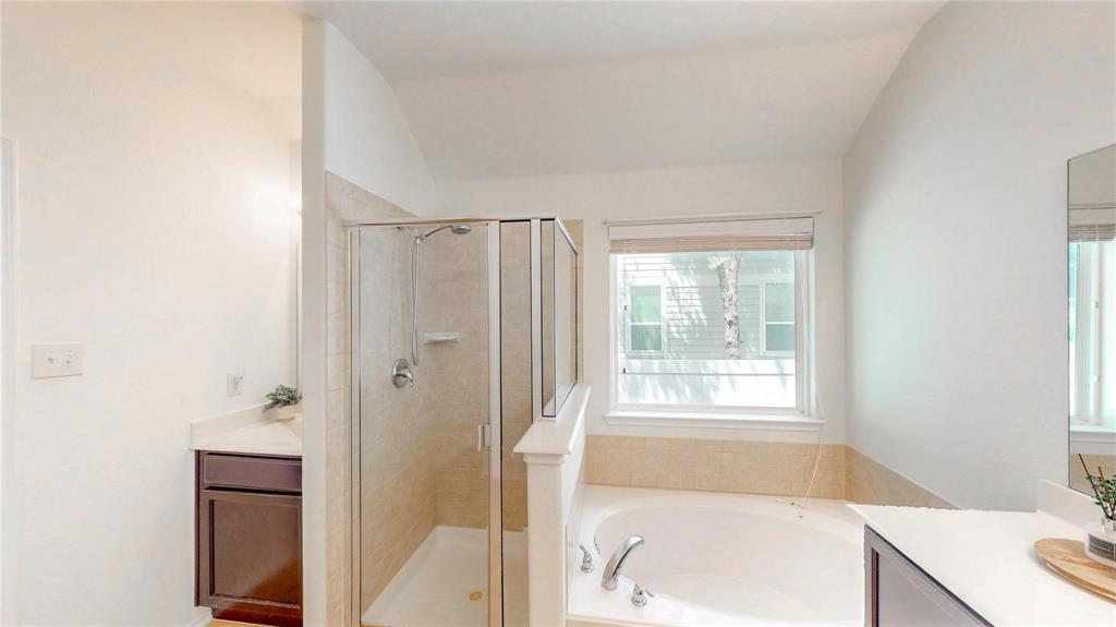1808 Dr Sanders Road Providence Village, TX 76227 - Photo 18 of 31 a bathroom with a bathtub and a sink