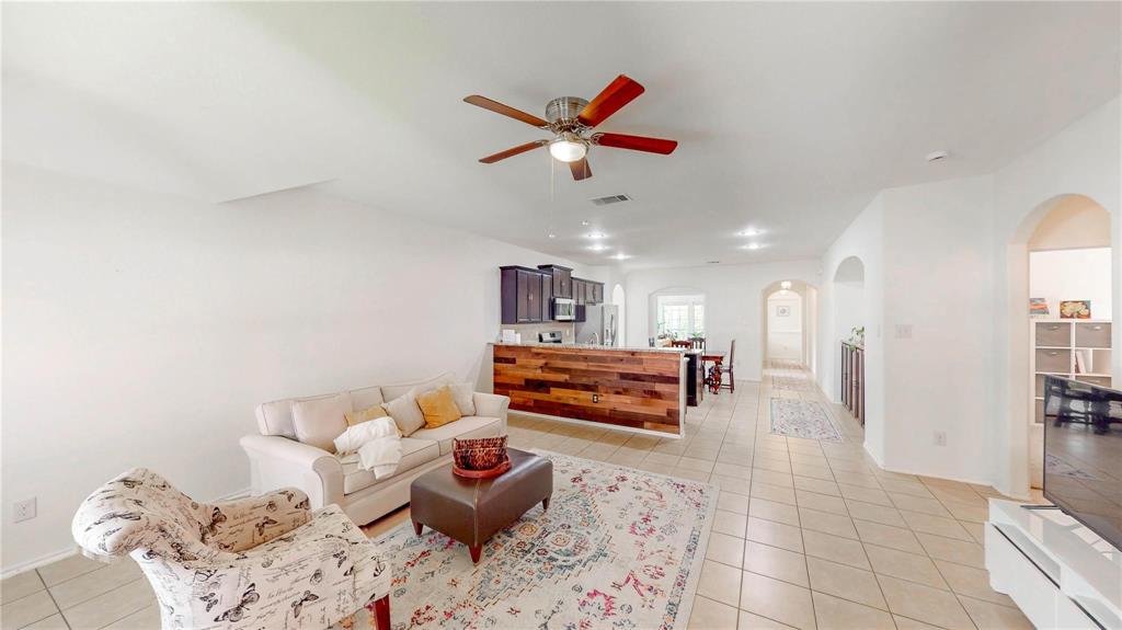1808 Dr Sanders Road Providence Village, TX 76227 - Photo 21 of 31 a living room with furniture and kitchen view