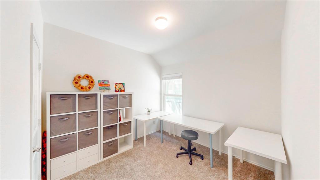 1808 Dr Sanders Road Providence Village, TX 76227 - Photo 22 of 31 a view of a workspace with furniture and a window