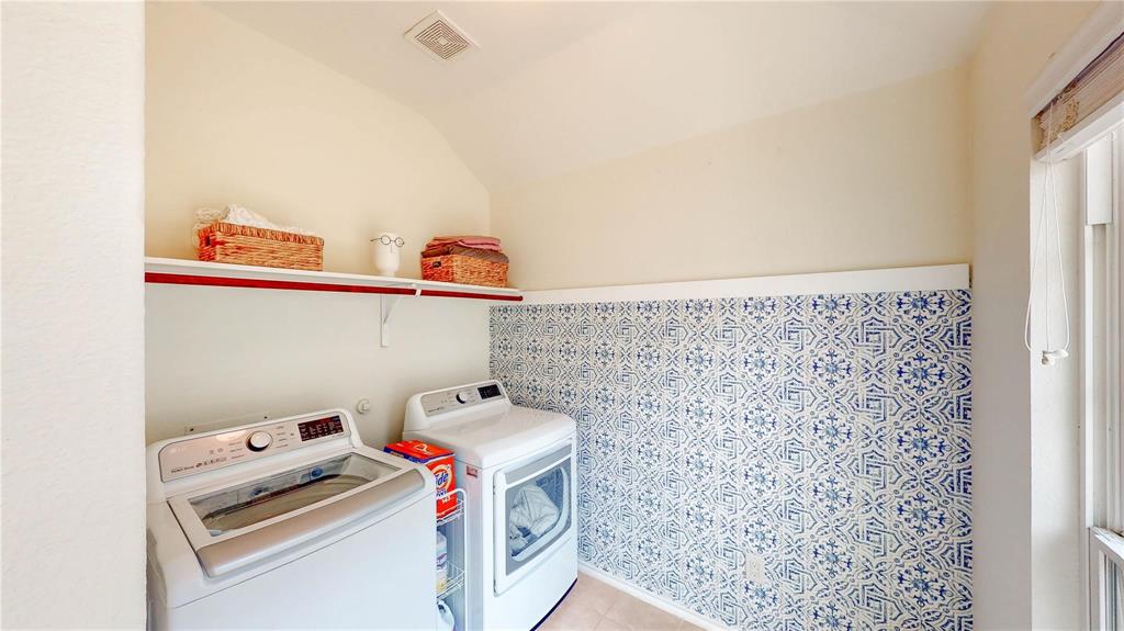 1808 Dr Sanders Road Providence Village, TX 76227 - Photo 26 of 31 a utility room with dryer and washer