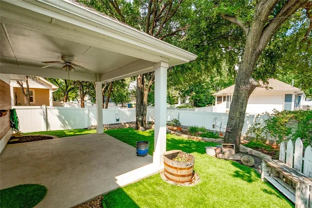 a view of a backyard with a garden and plants