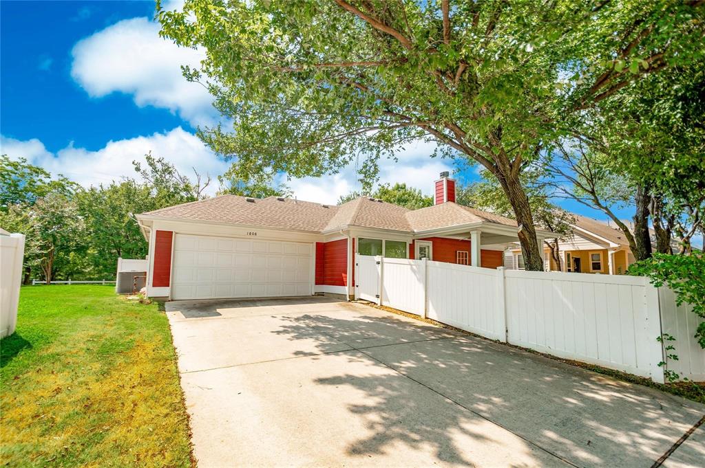 1808 Dr Sanders Road Providence Village, TX 76227 - Photo 29 of 31 a view of a house with a yard