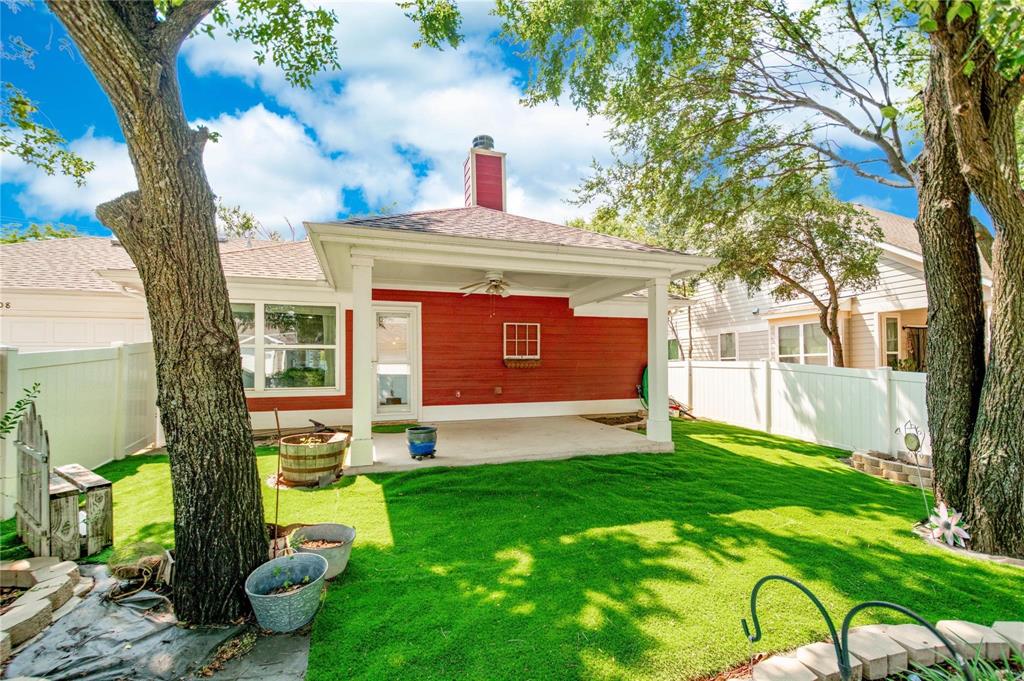 1808 Dr Sanders Road Providence Village, TX 76227 - Photo 31 of 31 a view of an house with backyard space and a tree