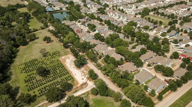 a view of a hallway to filled with entryway and wooden floor