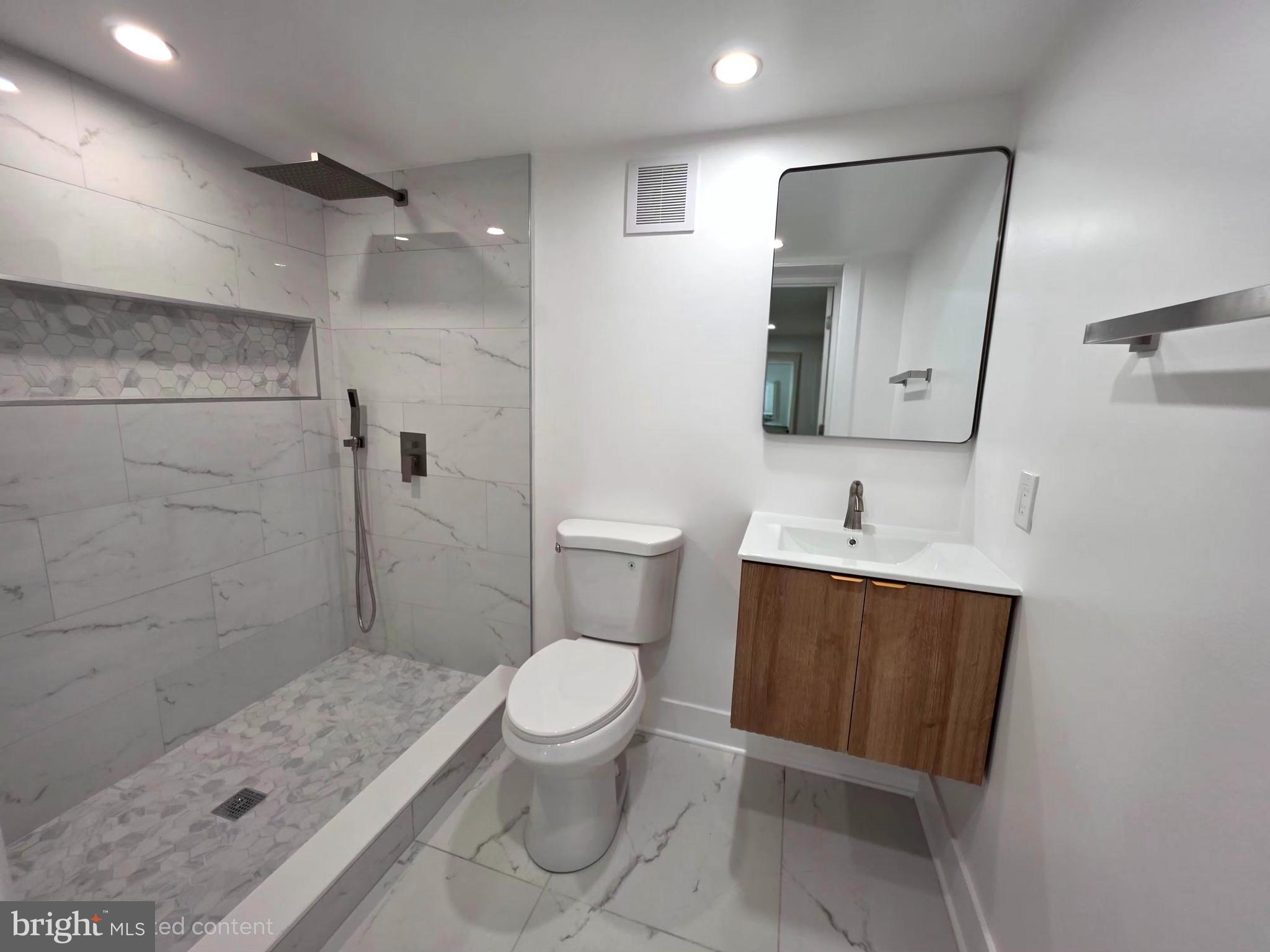 2206 Brinkley Road Fort Washington, MD 20744 - Photo 77 of 78 a bathroom with a sink toilet and shower