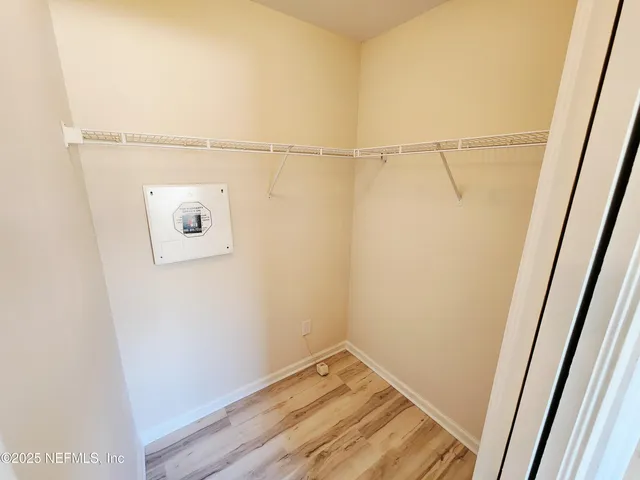 a view of room with window and ceiling fan