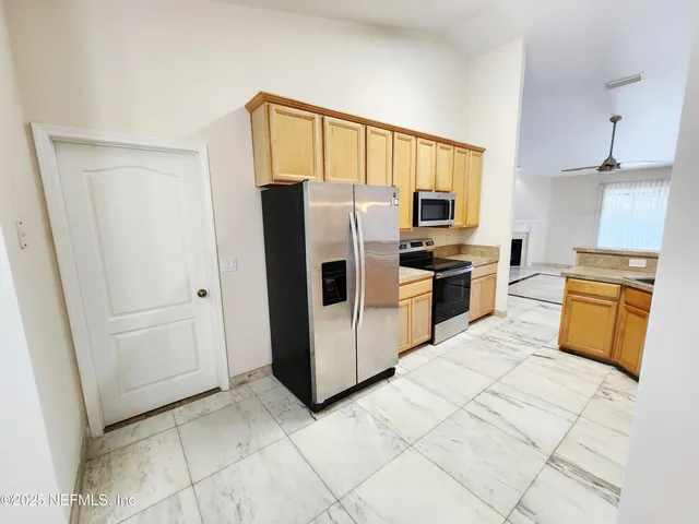 a view of livingroom with hardwood floor and fireplace