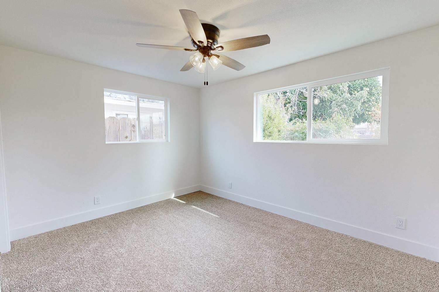 2441 Madrone Street Sutter, CA 95982 - Photo 18 of 47 an empty room with windows and fan