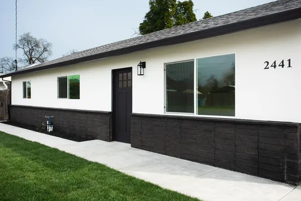 a front view of a house with a yard