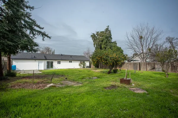 a view of a big yard next to a house