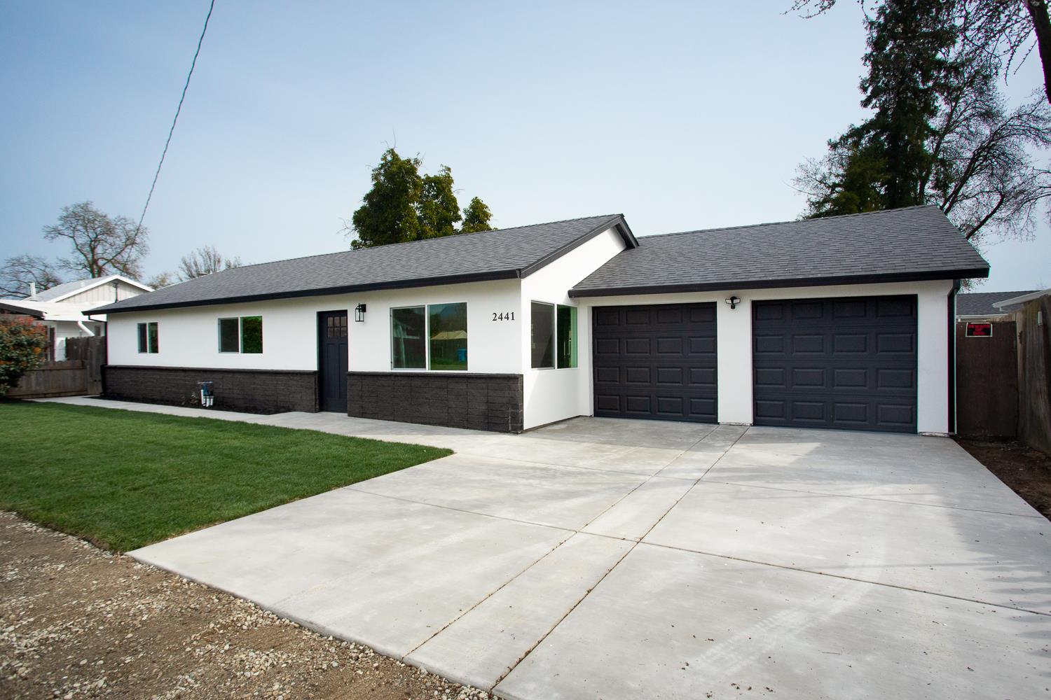 2441 Madrone Street Sutter, CA 95982 - Photo 6 of 47 a front view of a house with a yard and garage