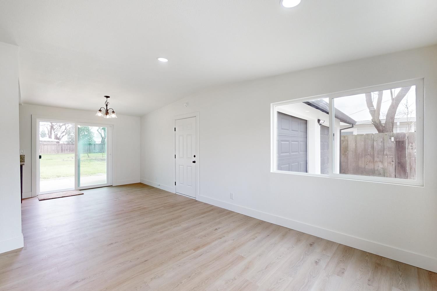 2441 Madrone Street Sutter, CA 95982 - Photo 10 of 47 a view of an empty room with a window and wooden floor