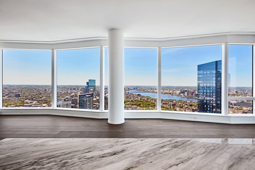 240 Devonshire Street, Unit 5801 Boston, MA 02110 - Photo 3 of 40 a view of a floor to ceiling window and wooden floor
