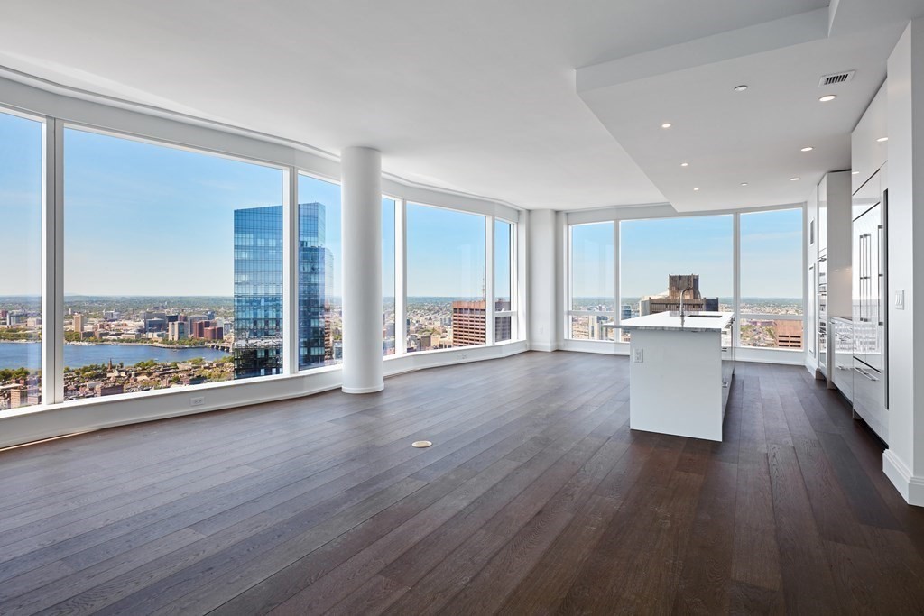 240 Devonshire Street, Unit 5801 Boston, MA 02110 - Photo 4 of 40 a view of a kitchen with wooden floor and a window