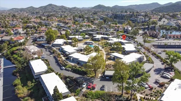 an aerial view of residential houses with outdoor space