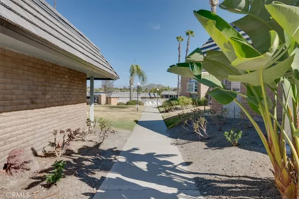 a front view of a house with outdoor seating
