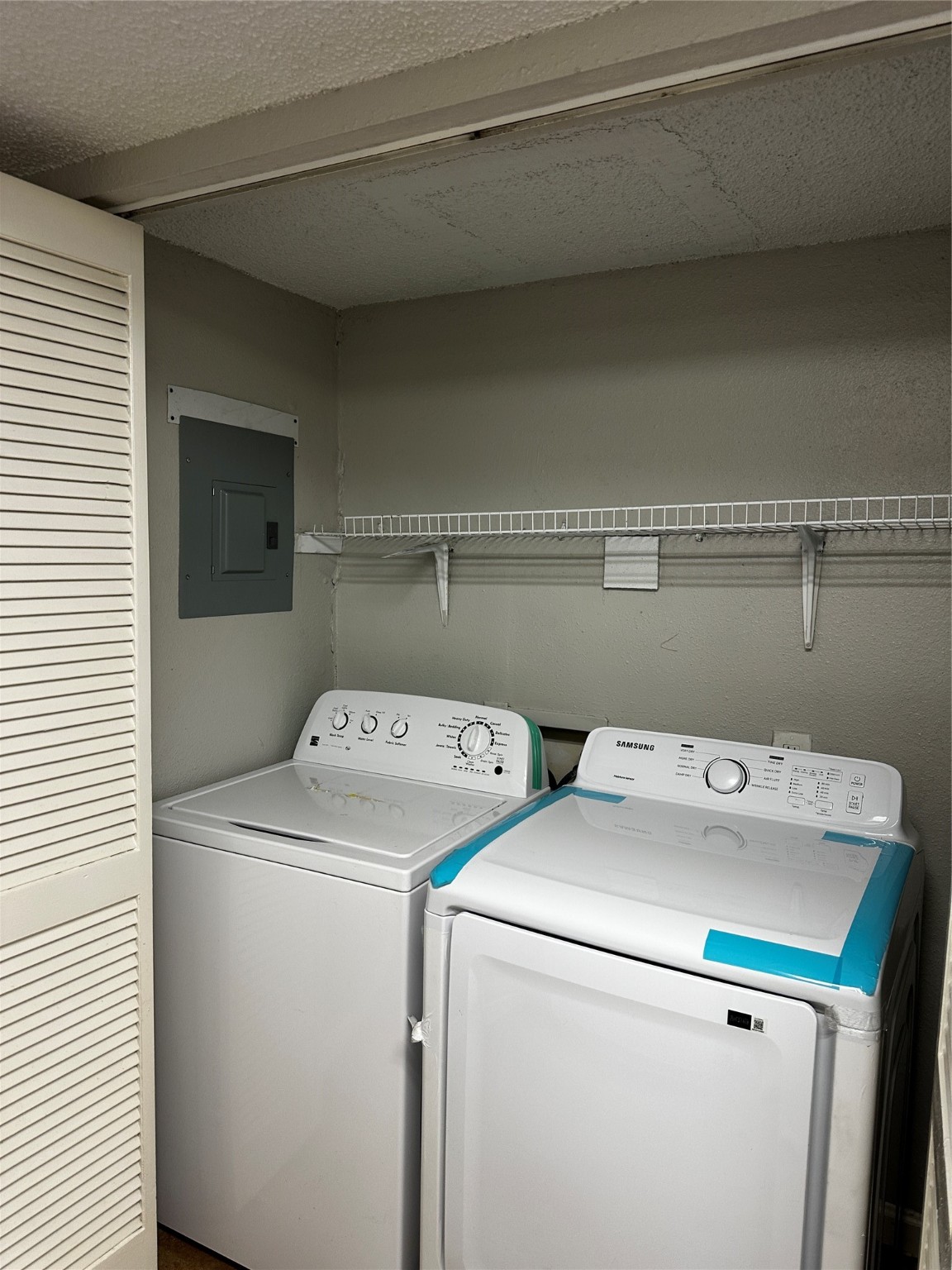 3756 Tanglewilde Street, Unit 8D Houston, TX 77063 - Photo 11 of 14 a utility room with dryer and washer