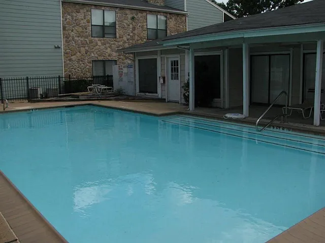 a front view of a house with swimming pool