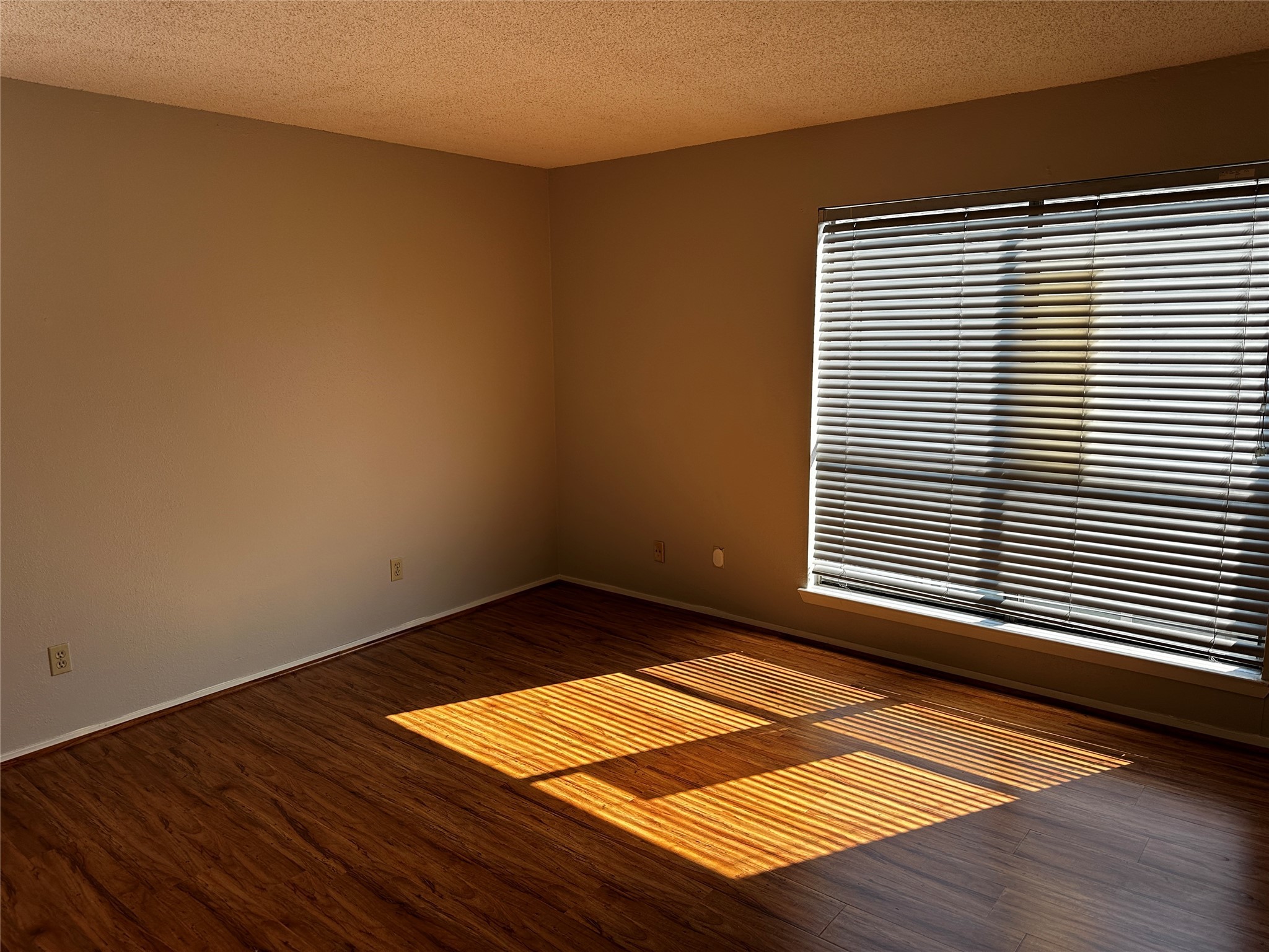 3756 Tanglewilde Street, Unit 8D Houston, TX 77063 - Photo 8 of 14 a view of a room with wooden floor and a window