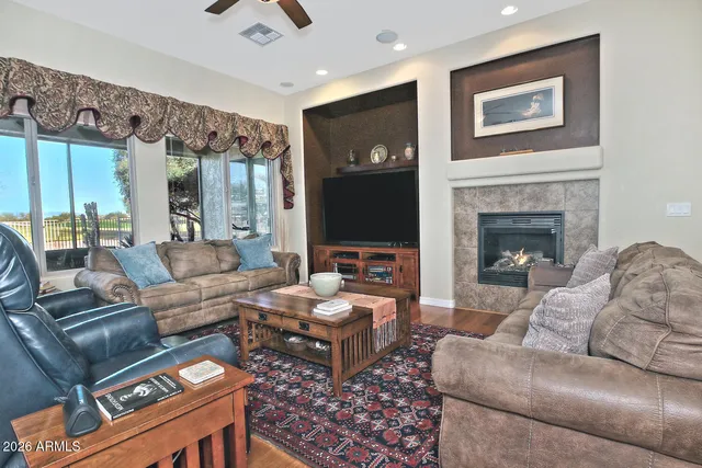 a spacious bedroom with a bed and a chandelier