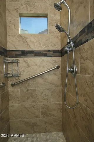 a bedroom with a bed and a table