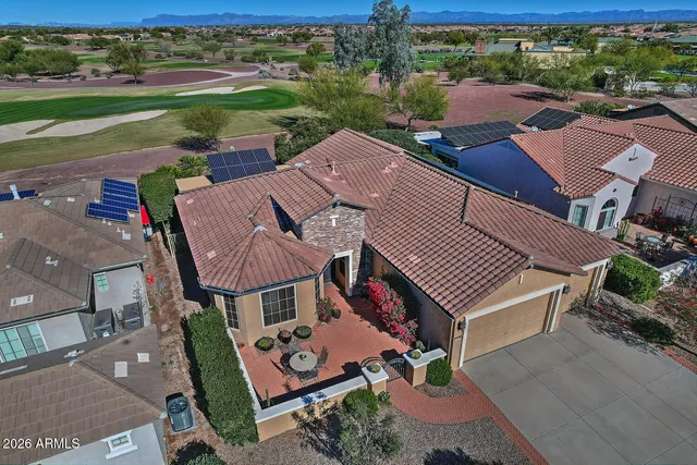 an aerial view of a house with a garden