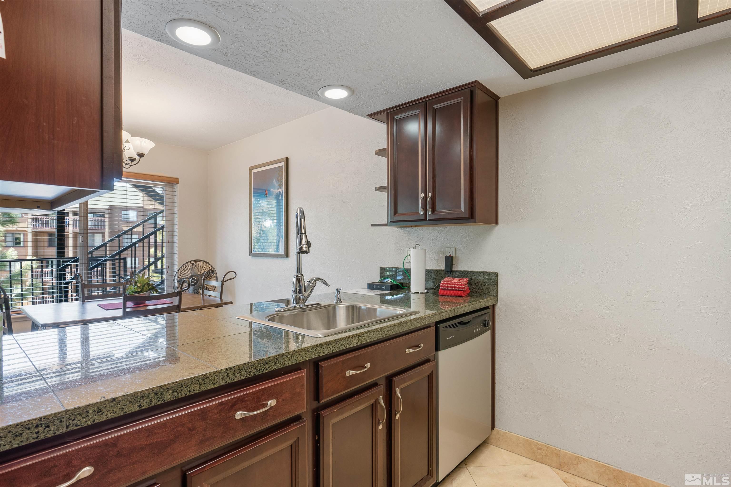 754 Boulder Court, Unit 9 Stateline, NV 89449 - Photo 12 of 38 a bathroom with a sink and a mirror