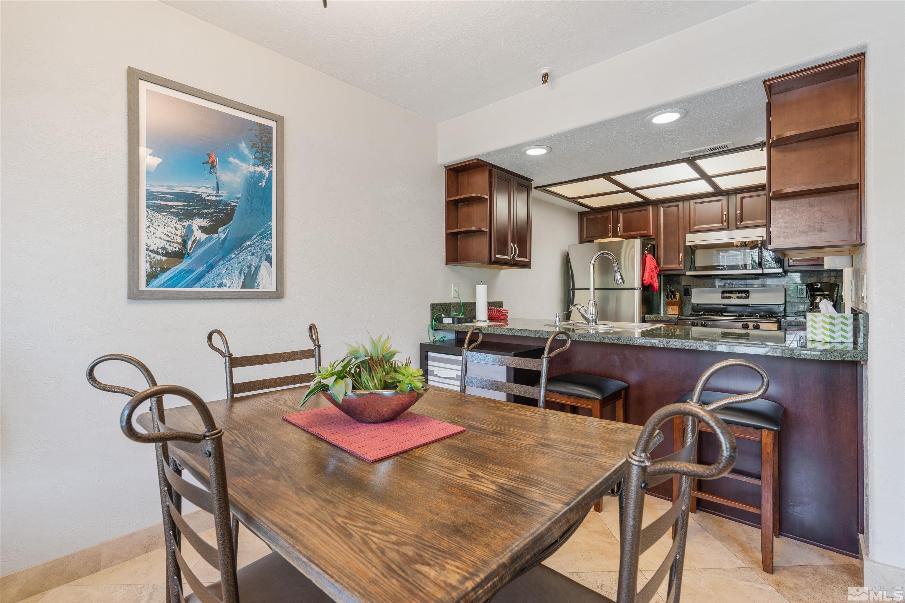 754 Boulder Court, Unit 9 Stateline, NV 89449 - Photo 13 of 38 a dinning room with furniture and window