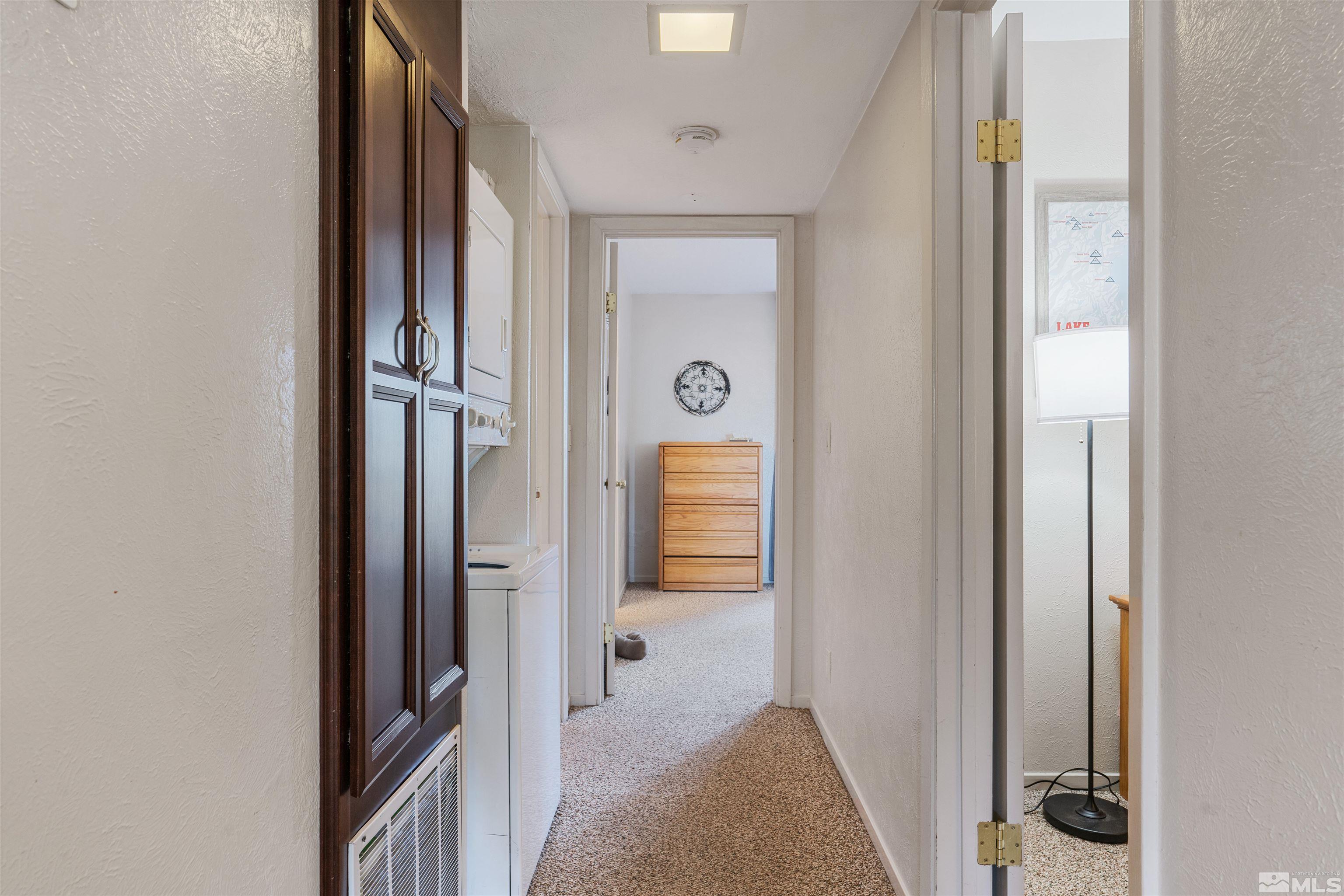 754 Boulder Court, Unit 9 Stateline, NV 89449 - Photo 15 of 38 a view of a hallway with wooden floor and closet
