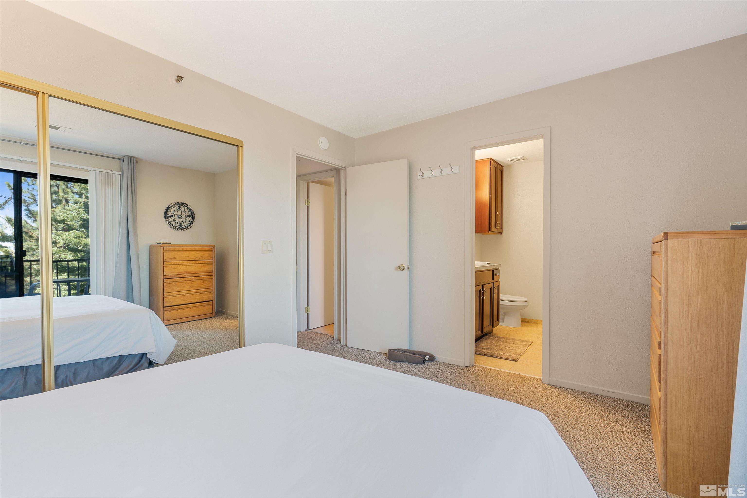 754 Boulder Court, Unit 9 Stateline, NV 89449 - Photo 18 of 38 a bedroom with a bed and a closet